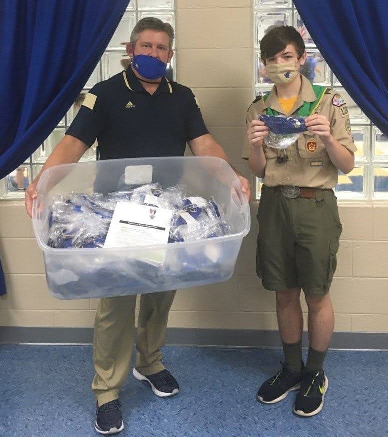 Presenting masks to a school official