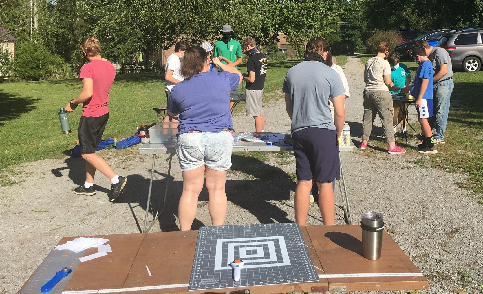 Volunteers working at outdoor tables